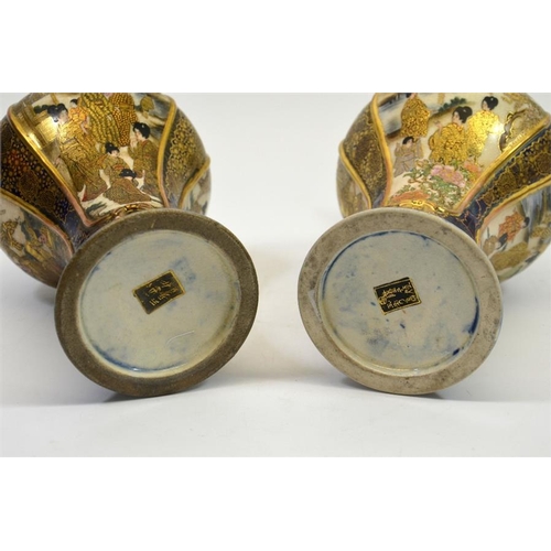 10 - A pair of Japanese Satsuma vases, Meiji, inverse baluster form, each with three scenic panels within... 