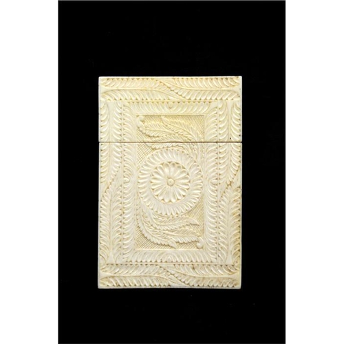 101 - λ A Chinese carved ivory card case, 19th century, engraved with geometric foliate design of rosette ... 