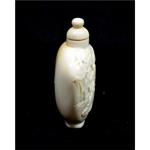 109 - λ A Chinese carved ivory snuff bottle, 19th century, tea ceremony under bamboo