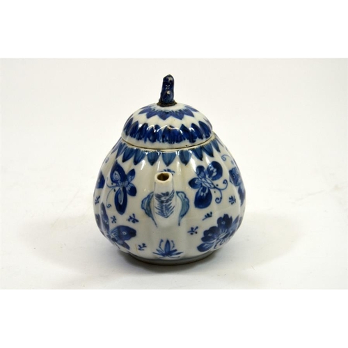 11 - A small Chinese blue and white teapot, 18th century, decorated with butterflies, 11cm high