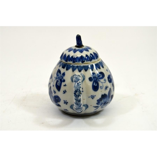 11 - A small Chinese blue and white teapot, 18th century, decorated with butterflies, 11cm high