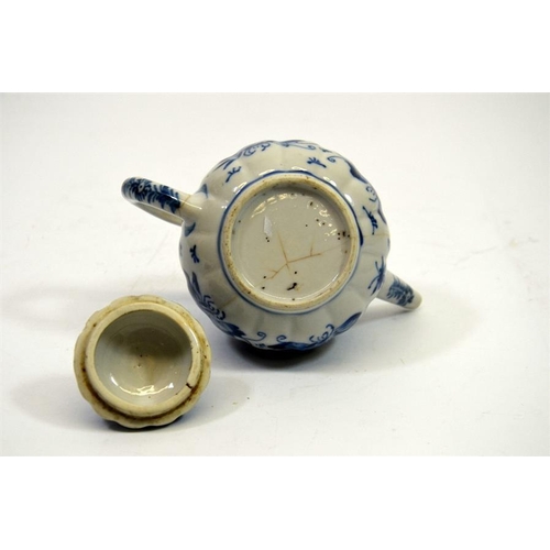 11 - A small Chinese blue and white teapot, 18th century, decorated with butterflies, 11cm high