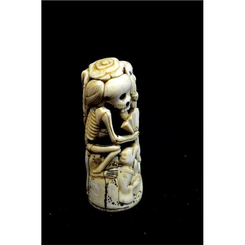 111 - λ A Japanese carved ivory sword pommel, Meiji, 19th century, carved and reticulated with skeleton, z... 