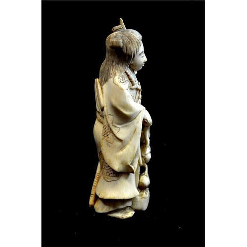 115 - λ A Japanese carved ivory okimono, Meiji, 19th century, modelled as a female warrior, 12.5cm high