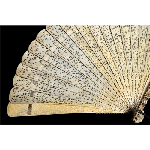 131 - A late 18th - early 19th century Chinese Canton export ivory brise fan with guardsticks carved in re... 