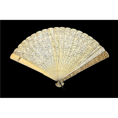 131 - A late 18th - early 19th century Chinese Canton export ivory brise fan with guardsticks carved in re... 