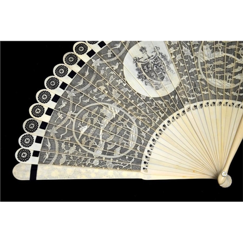 132 - λ An unusual Chinese Canton export carved ivory grand brisé mourning fan, late 18th/early 19th centu... 