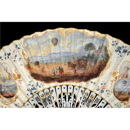 136 - λ A late 18th century painted ballooning fan, the carved and gilt guards with mother-of-pearl veneer... 