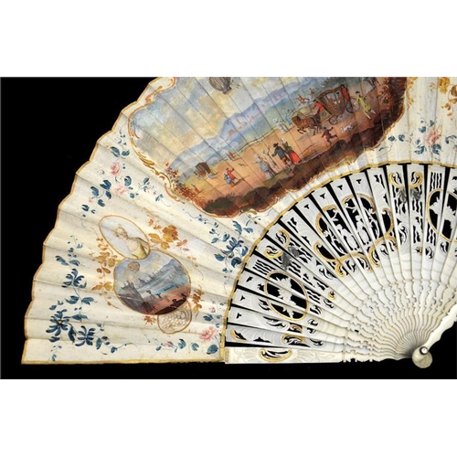 136 - λ A late 18th century painted ballooning fan, the carved and gilt guards with mother-of-pearl veneer... 