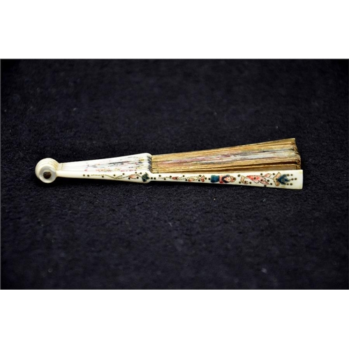 138 - λ A very rare 18th century miniature ivory fan, the guards with the finest possible piqué work and p... 