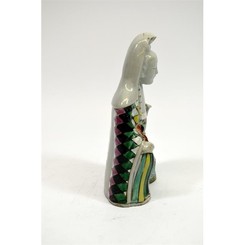 14 - A Chinese famille rose figure of Guanyin, polychrome and blanc de Chine, 20cm high