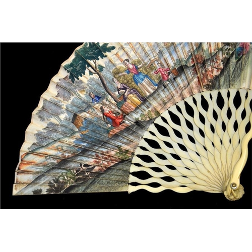 145 - λ A printed and hand coloured early 18th century ivory fan, with plain ivory serpentine sticks, the ... 