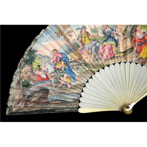 149 - λ An early 18th century ivory fan, with carved ivory guards and plain sticks, the guards carved at t... 