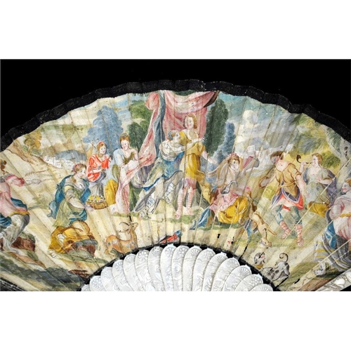 150 - λ An early 18th century ivory fan, with carved ivory guards and sticks, the guards with a most unusu... 