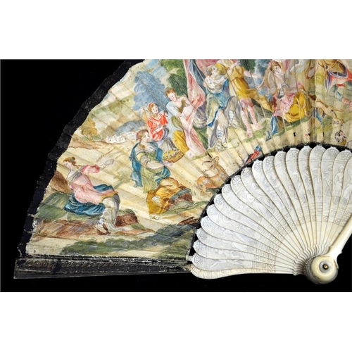 150 - λ An early 18th century ivory fan, with carved ivory guards and sticks, the guards with a most unusu... 