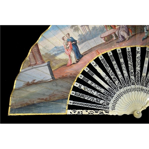 153 - λ A late 18th century ivory fan, with elaborately carved and pierced guards and sticks, the guards c... 