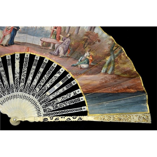 153 - λ A late 18th century ivory fan, with elaborately carved and pierced guards and sticks, the guards c... 