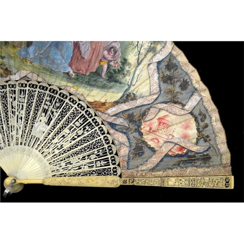 157 - λ A fine mid 18th century ivory fan, with elaborately carved and pierced ivory guards and sticks, th... 