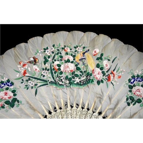 160 - λ A 19th century Chinese ivory and feather export fan, the guards profusely and deeply carved with o... 