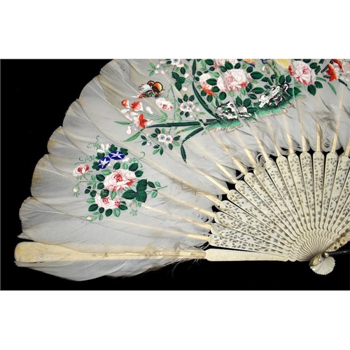 160 - λ A 19th century Chinese ivory and feather export fan, the guards profusely and deeply carved with o... 