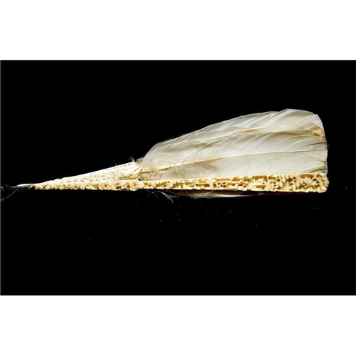 160 - λ A 19th century Chinese ivory and feather export fan, the guards profusely and deeply carved with o... 