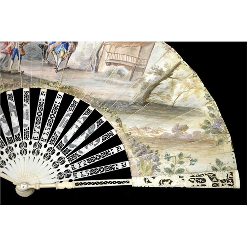 163 - λ An 18th century ivory fan, with elaborately carved and pierced Chinoiserie guards and sticks, the ... 