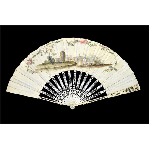 163 - λ An 18th century ivory fan, with elaborately carved and pierced Chinoiserie guards and sticks, the ... 