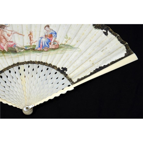 167 - λ An 18th century ivory fan with plain ivory sticks and guards. The leaf is hand painted with a pipe... 