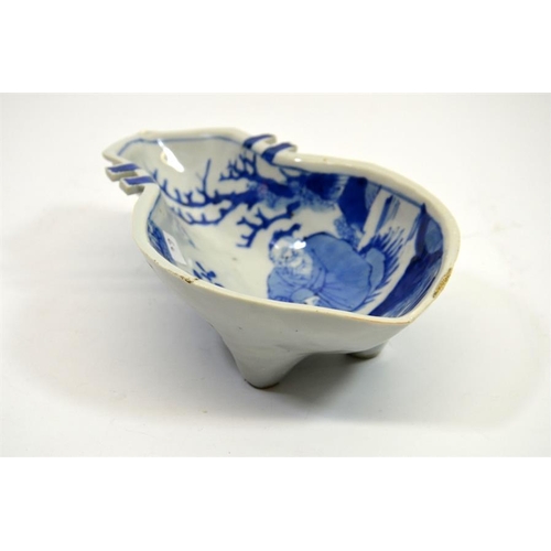 17 - A Chinese blue and white dish, probably Ming, gourd form, painted with scholar in garden and verse, ... 