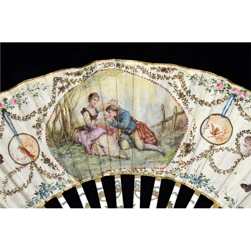 173 - λ A 19th century fan with a hand painted  leaf mounted à l'anglaise fashion depicting lovers in a co... 