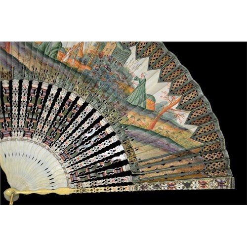 174 - An 18th century decoupé fan, hand painted in tones of green and orange with a scene of a lady inviti... 