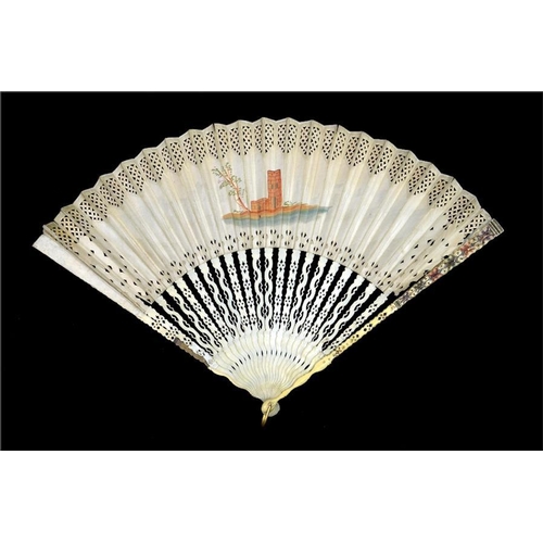 174 - An 18th century decoupé fan, hand painted in tones of green and orange with a scene of a lady inviti... 