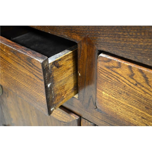 183 - A 19th century Chinese elm chest, two drawers over cupboard doors