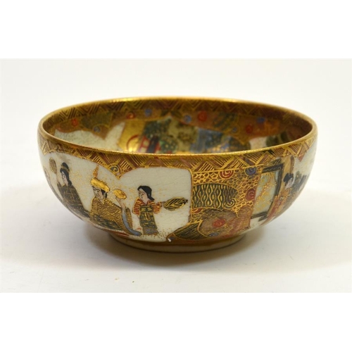 19 - A Japanese Satsuma bowl, Meiji, the centre decorated with seated deities in a temple landscape, sign... 