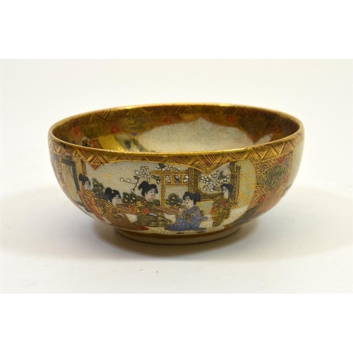 19 - A Japanese Satsuma bowl, Meiji, the centre decorated with seated deities in a temple landscape, sign... 