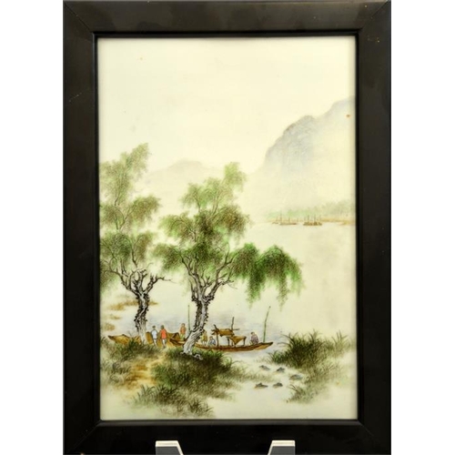 24 - A Chinese famille verte plaque, painted with figures and boats in a watery misty landscape, 25cm x 1... 