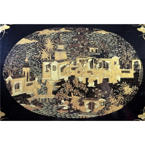 38 - A Chinese lacquer tray  decorated with a figural garden landscape in a central cartouche, surrounded... 