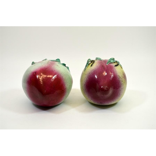 5 - A pair of Chinese porcelain peaches, 19th century, polychrome enamelled, 15cm diameter (2)