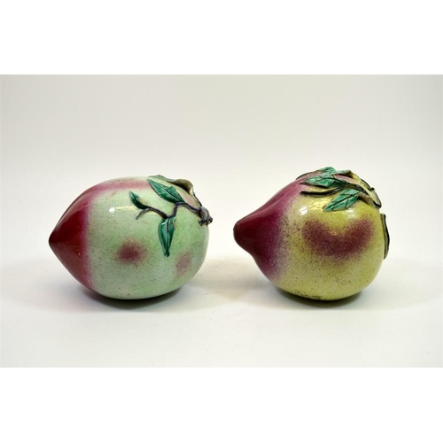 5 - A pair of Chinese porcelain peaches, 19th century, polychrome enamelled, 15cm diameter (2)