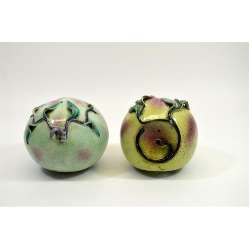 5 - A pair of Chinese porcelain peaches, 19th century, polychrome enamelled, 15cm diameter (2)