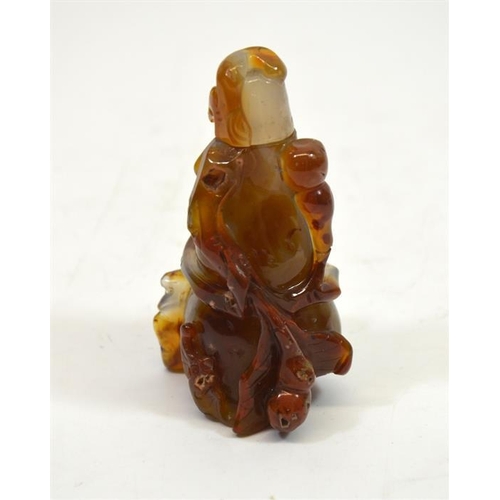 62 - A Chinese carved agate snuff bottle, in the form of a gourd, in high relief