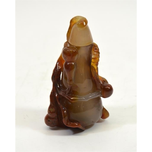 62 - A Chinese carved agate snuff bottle, in the form of a gourd, in high relief