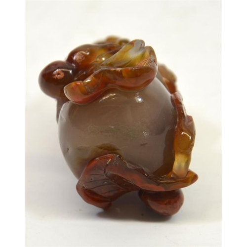 62 - A Chinese carved agate snuff bottle, in the form of a gourd, in high relief