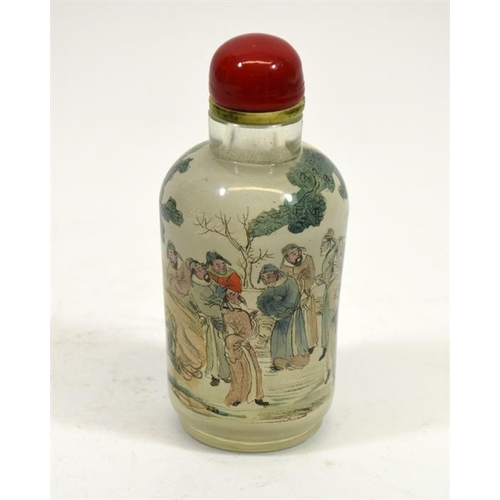 67 - A Chinese glass snuff bottle, cylindrical form, reverse painted with courtiers playing games in a ga... 