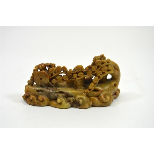 69 - A Chinese carved stone figure group, muses and deities in a garden, 70cm long