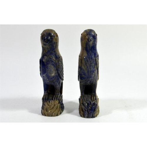 72 - A pair of Oriental carved lapis parrots, set with amber coloured eyes, 17cm high (2)