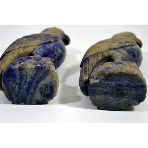 72 - A pair of Oriental carved lapis parrots, set with amber coloured eyes, 17cm high (2)