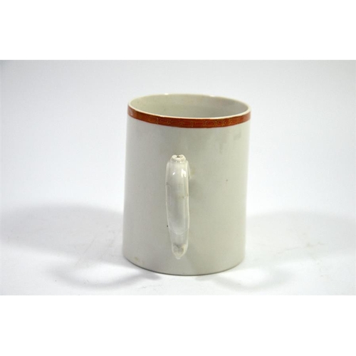 73 - A Japanese monochrome painted tankard, 18th century, orange landscape below gilt key border, 12cm hi... 