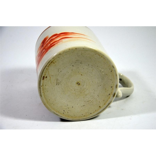 73 - A Japanese monochrome painted tankard, 18th century, orange landscape below gilt key border, 12cm hi... 