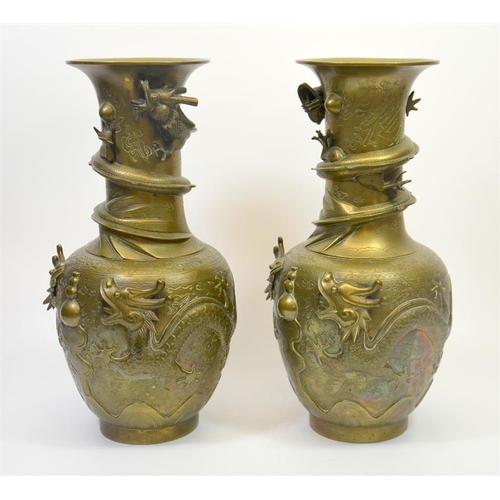 74 - A large pair of Chinese bronze vases, cast in relief with dragons and pearls, cast marks set to the ... 